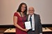 Dr. Nagib Callaos, General Chair, giving Dr. Tilia Stingl De Vasconcelos a plaque "In Appreciation for Delivering a Great Keynote Address at a Plenary Session."